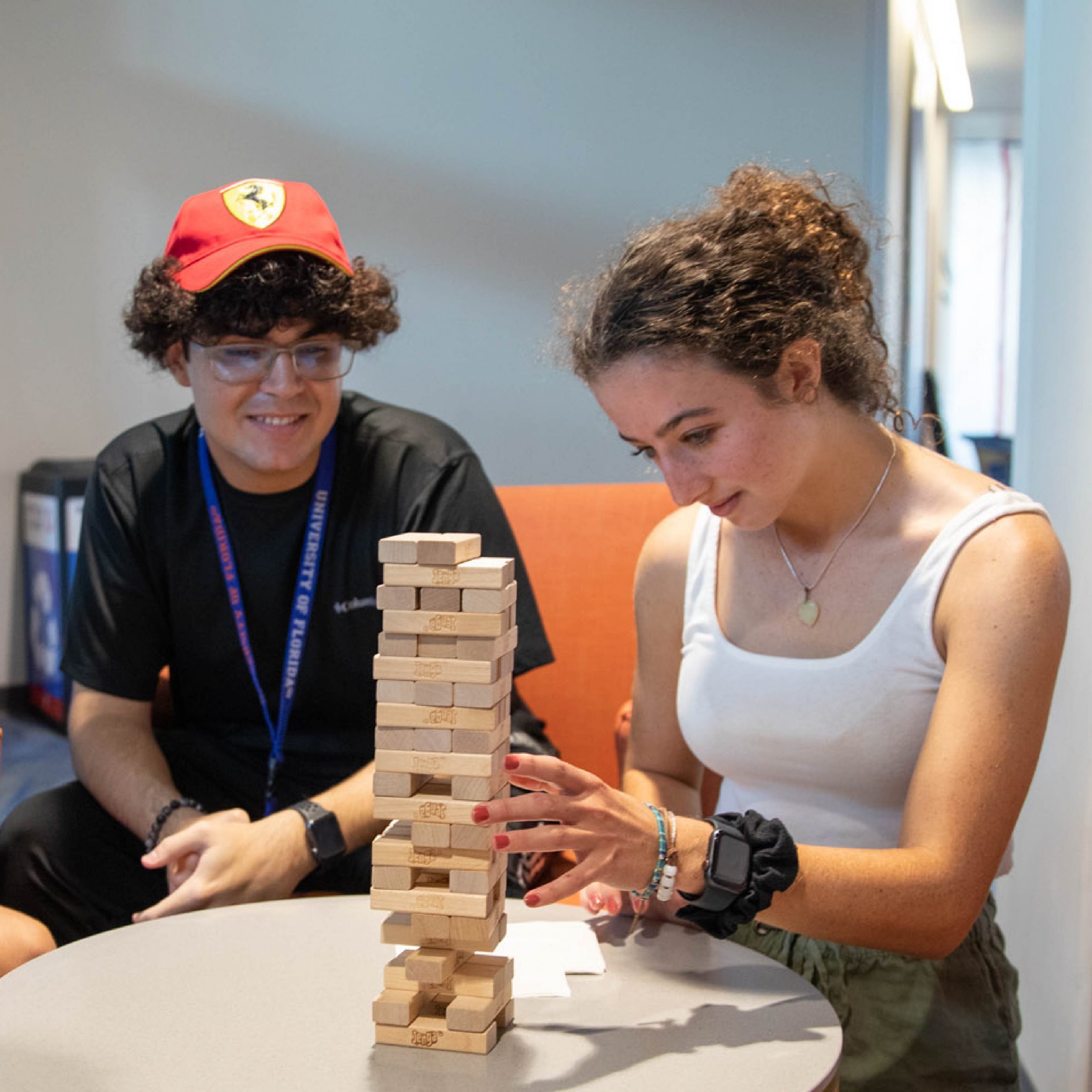 Two students playing Jenga.