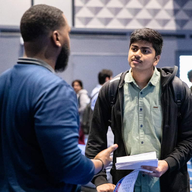 A student talking with another person.